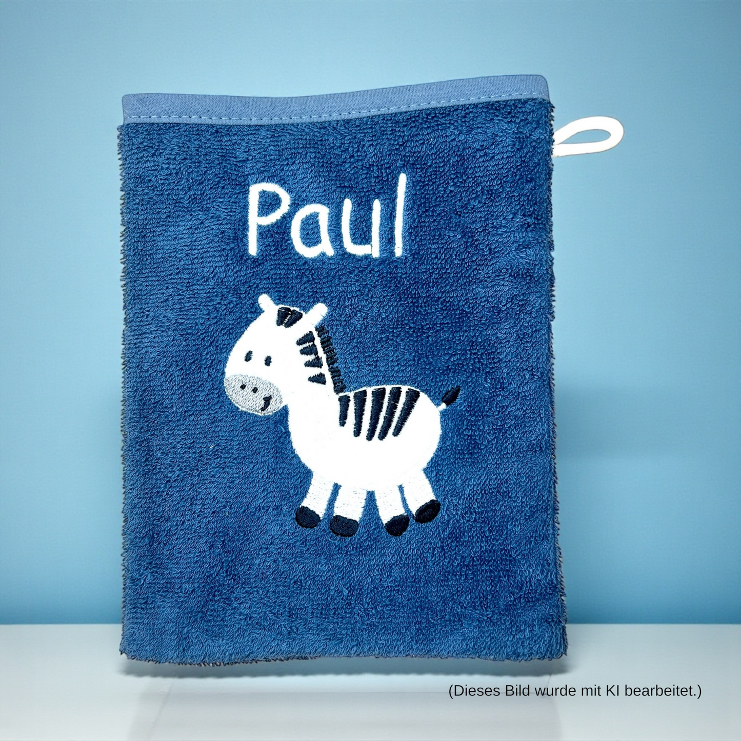 Baby Waschlappen, dunkelblau mit Zebra-Motiv und Name bestickt, aus Baumwolle